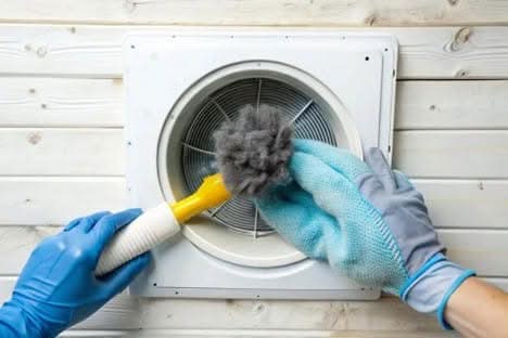 Oak Run’s Top Dryer Vent Cleaning with Expert Service for a Safer Home 1 Professional technician removing a large clump of lint from a white dryer vent to prevent house fires.