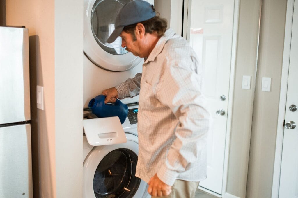 Dryer Vent Cleaning in Leesburg: Ultimate Fire Safety Guide 1 technician performing dryer vent cleaning in Leesburg home laundry room